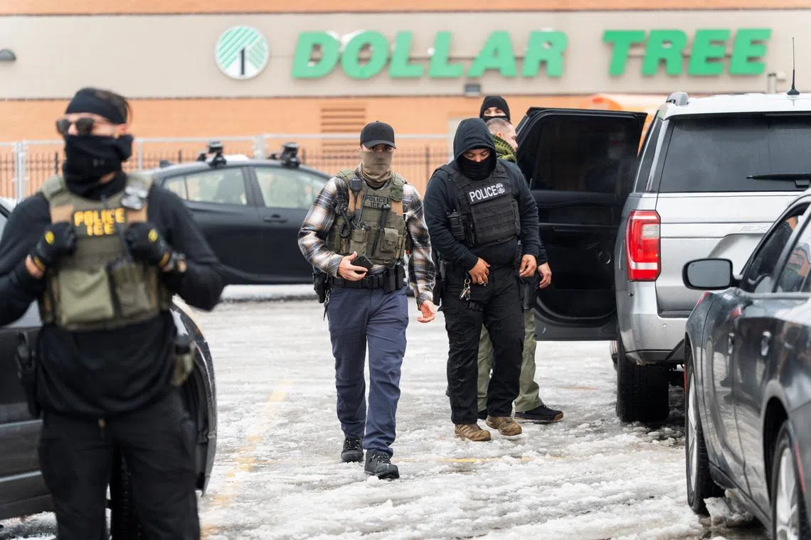 Members of U.S. Immigration and Customs Enforcement (ICE) conduct a raid as part of U.S. President Donald Trump's immigration policy in Minneapolis, Minnesota, U.S., January 6, 2026.  REUTERS/Tim Evans