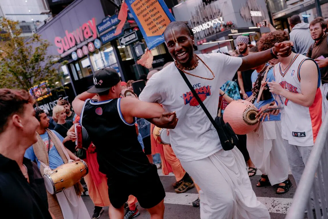 Fans of the New York Knicks dance before the start of Game 4 of the NBA Finals between the New York Knicks and the San Antonio Spurs near Madison Square Garden.