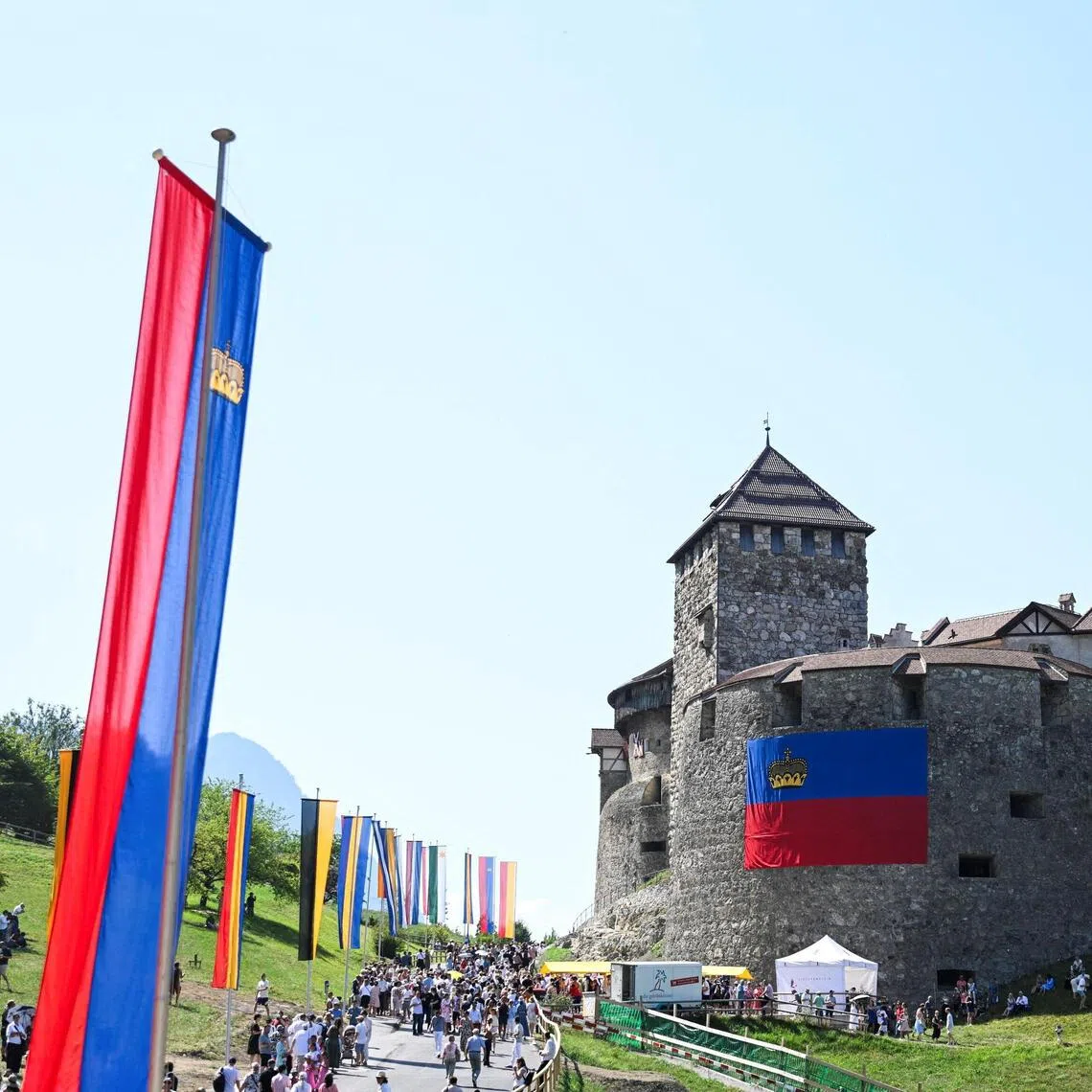 Spectators walking past the Vaduz Castle during Liechtenstein’s National Day celebrations on Aug 15.