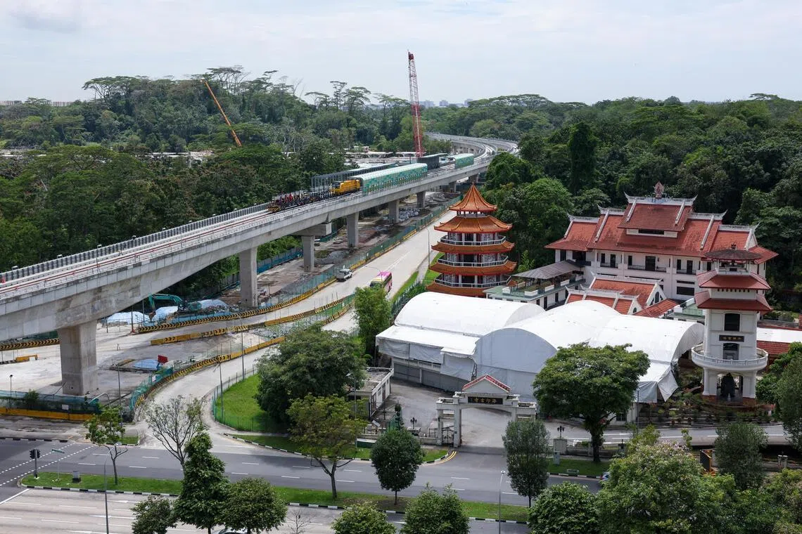 ST20260226_202680200765/Jasel Poh/vcrail04

Photo of a section of track between JS2 Choa Chu Kang West Station and JS2A Station with Hai Inn Temple in the foreground on Feb 26, 2026.