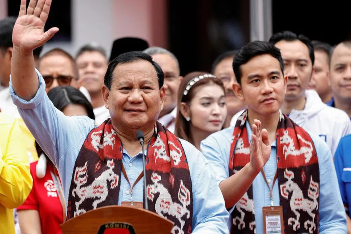 File photo: Indonesia's defence minister and presidential candidate, Prabowo Subianto, along with his running mate, Gibran Rakabuming Raka, who is the eldest son of Indonesian President Joko Widodo and Surakarta's Mayor, wave after registering themselves for next year's presidential election, at the election commission headquarters in Jakarta, Indonesia, October 25, 2023. REUTERS/Willy Kurniawan/File photo