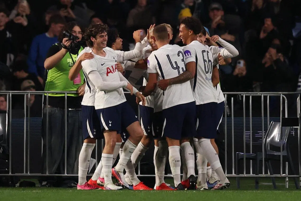 Tottenham Hotspur players celebrate after scoring the second goal in the 2-1 pre-season friendly win over Chelsea.