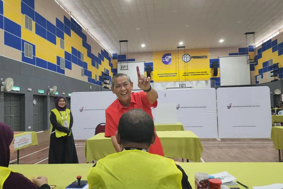 Negeri Sembilan caretaker Menteri Besar Aminuddin Harun casting his ballot at a polling station on Aug 1.