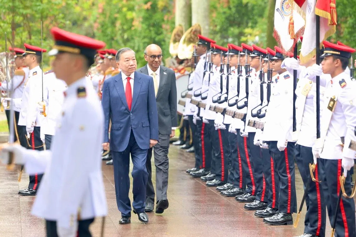 Vietnamese President To Lam receiving a ceremonial welcome by President Tharman Shanmugaratnam on May 29.