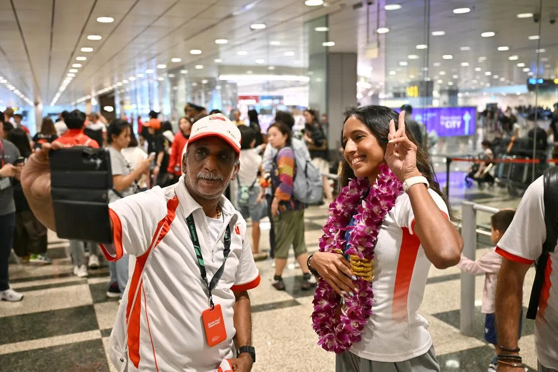 National sprinter Shanti Pereira takes a selfie with supporter Gagan Velappakutty at Changi Airport Terminal 3.