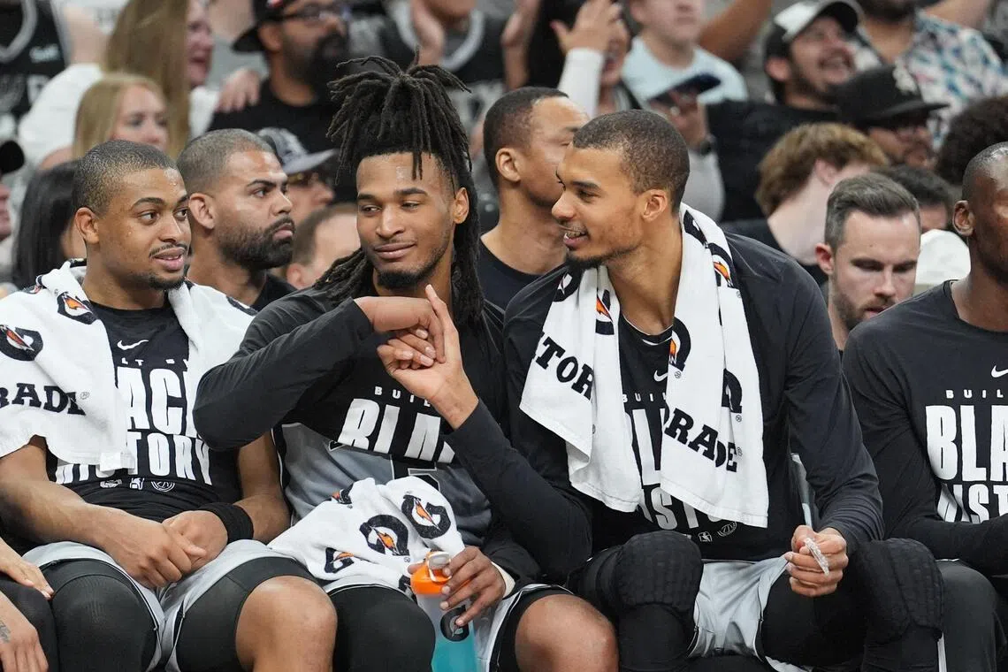 San Antonio Spurs forward Victor Wembanyama (right) shaking the hand of guard Stephon Castle during the second half of the 138-125 win over the reeling Dallas Mavericks  at Frost Bank Center on Feb 7, 2026.