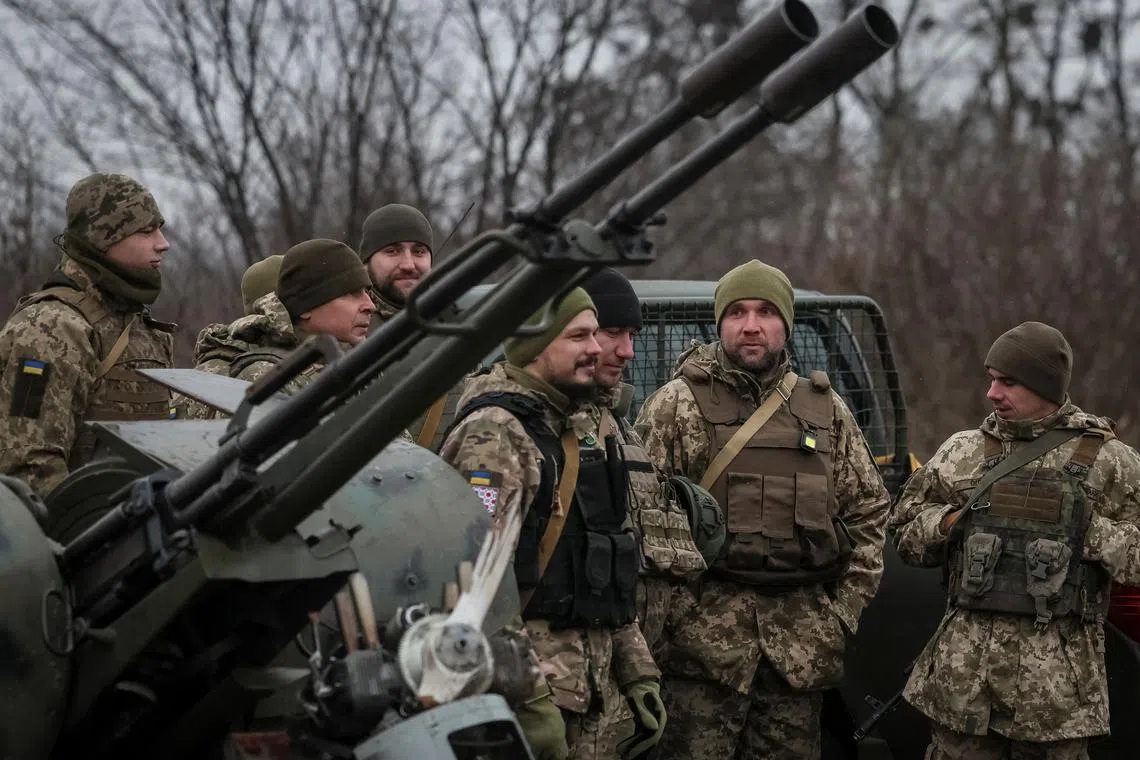 Ukrainian servicemen from air defence units prepare for an award ceremony after repelling the second biggest Russian missile and drone attack in five days, amid Russia's attack on Ukraine, near Kyiv, Ukraine January 3, 2024. REUTERS/Gleb Garanich