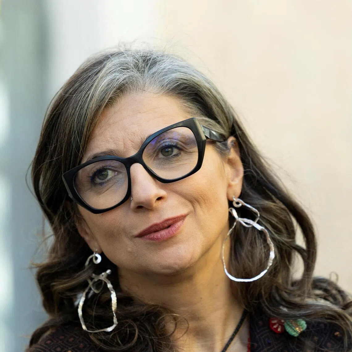 United Nations Special Rapporteur on the situation of human rights in the occupied Palestinian territory, Francesca Albanese listens to a journalist during an interview ahead of the conference on "A Cartography of Genocide: Israel's Conduct in Gaza since October 2023", an investigative project on Israeli-Palestinian conflict, at the Roma Tre University, in Rome, Italy, October 6, 2025. REUTERS/Remo Casilli