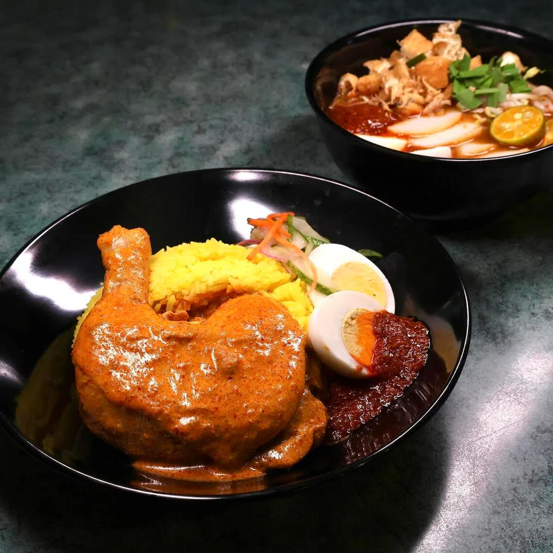 Nasi Kunyit (left) and Mee Siam (right) at Nya Nya.