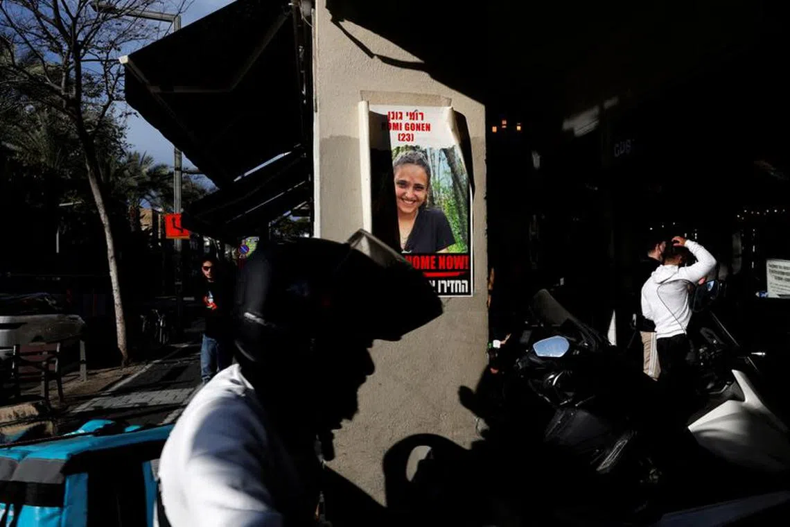 FILE PHOTO: A photo of a hostage kidnapped in the deadly October 7 attack on Israel by the Palestinian Islamist group Hamas is stuck outside a restaurant in Tel Aviv, Israel, January 31, 2024. REUTERS/Susana Vera