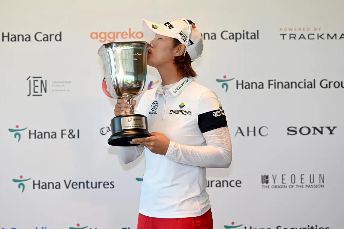 South Korea Park Ji-young celebrates with the trophy after winning the Hana Financial Group Singapore Women’s Open on Sunday.