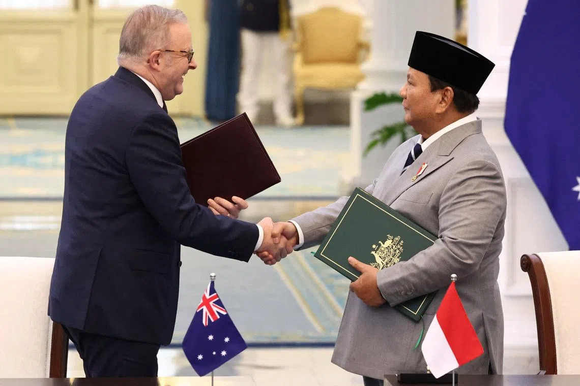 Australian Prime Minister Anthony Albanese shakes hands with Indonesian President Prabowo Subianto during a signing ceremony on a security agreement between the two countries, following their meeting at the Merdeka Palace in Jakarta, Indonesia, February 6, 2026. REUTERS/Willy Kurniawan