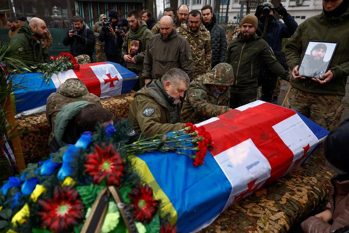 Members of the Georgian Legion fighting in Ukraine bid farewell to two brothers-in-arms killed in a fight against Russian troops in Southern Ukraine.