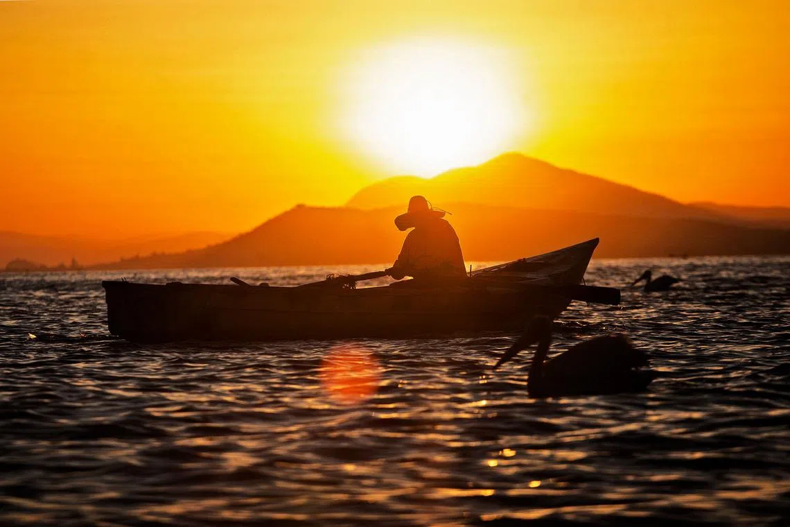 A fishing boat approaching the island of Petatan in the municipality of Cojumatlan de Regules, Michoacan state, Mexico on Febr 23, 2024. 