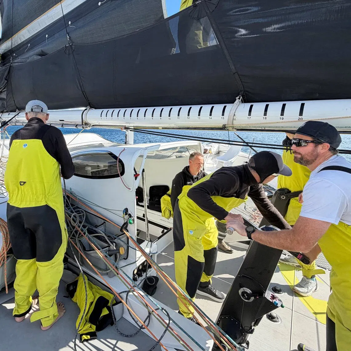 Sailing - 2026 RORC Transatlantic Race - Arrecife, Lanzarote, Spain - January 9, 2026 Argo's crew prepare the MOD70 trimaran for practice ahead of Sunday's start to the Lanzarote to Antigua RORC Transatlantic Race REUTERS/Ossian Shine