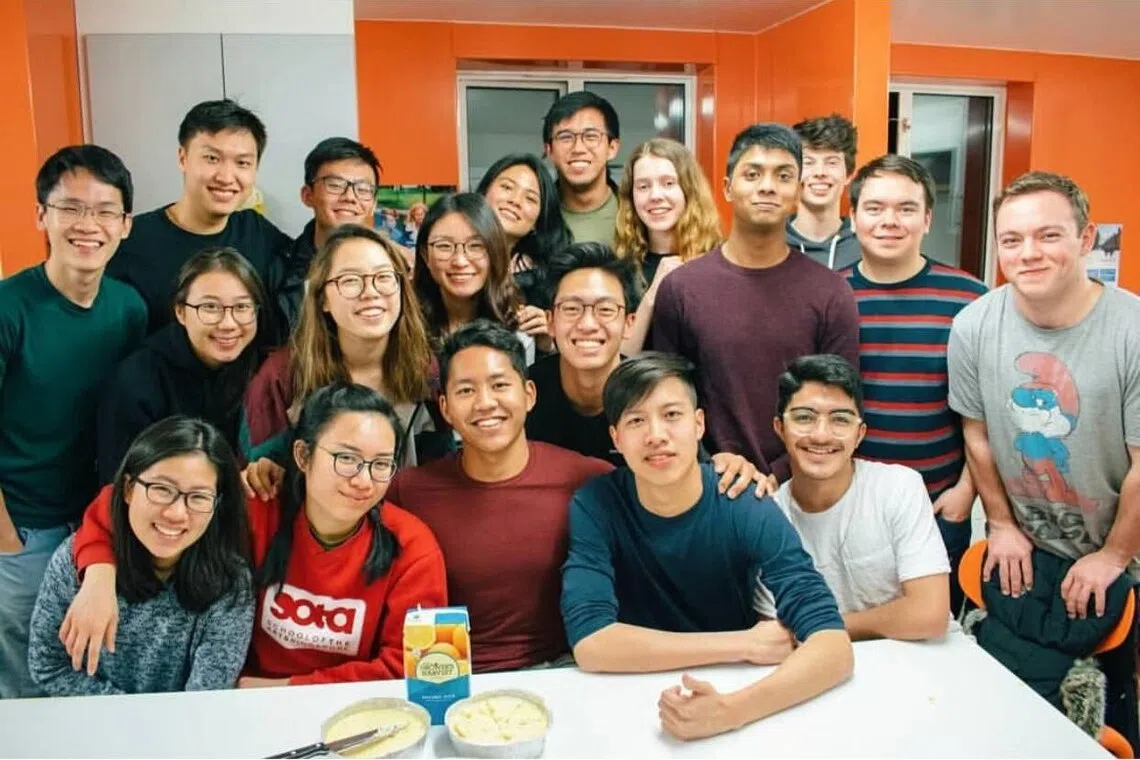 singaporean alfian with friends from university of warwick celebrating his 22nd birthday at student accommodation kitchen