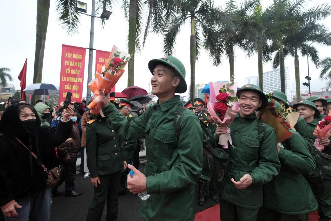  Recruits walking to a bus after a military recruitment ceremony held at Ba Dinh district in Hanoi, Vietnam, 26 Feb 26, 2024. Some 74 recruits participated in the Ba Dinh district ceremony, while nearly 4,500 individuals attended recruitment ceremonies across 30 districts in Hanoi.