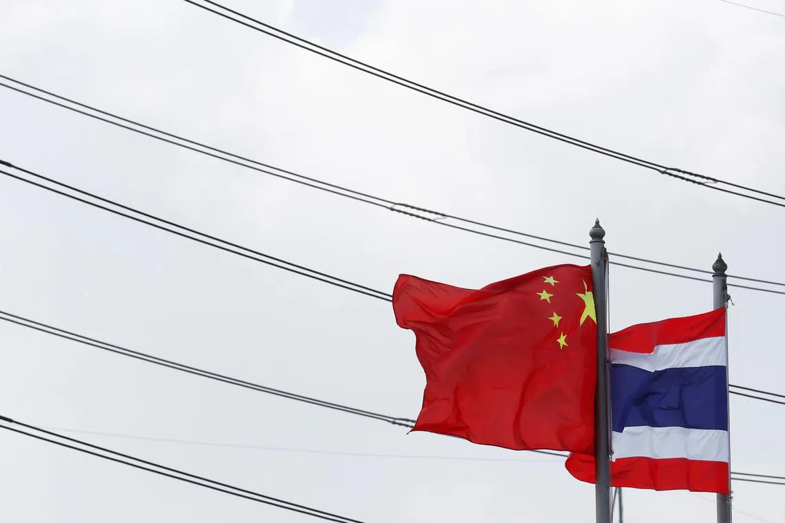 Flags flutter at an entrance of Thai-Chinese Rayong Industrial Zone in Rayong province, east of Bangkok, Thailand, April 7, 2016. REUTERS/Chaiwat Subprasom