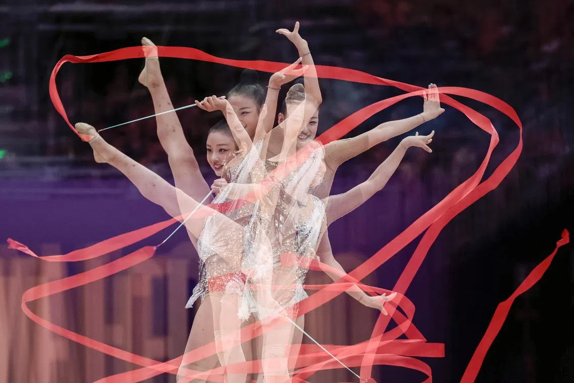A multiple exposure picture of Jiin Sohn of South Korea in action during the ribbon exercise at the 40th World Tournament of Rhythmic Gymnastics in Valencia, Spain, Aug 23.