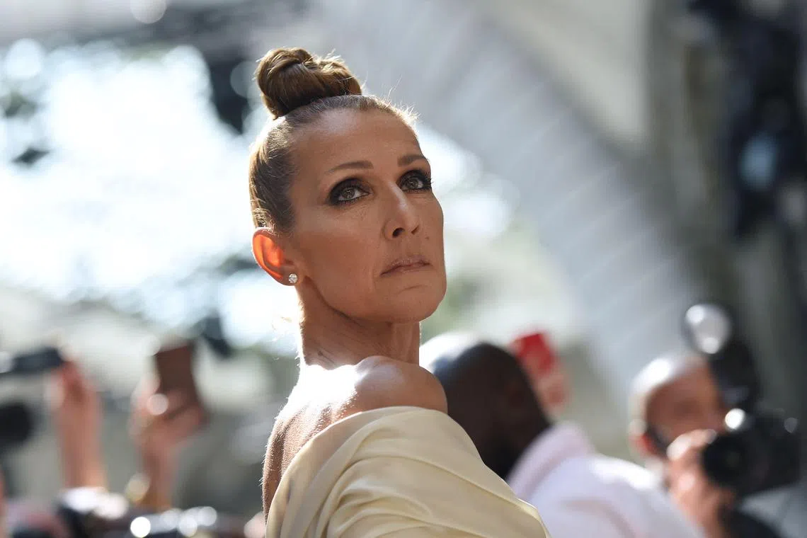 (FILES) Canadian singer Celine Dion arrives for the Alexandre Vauthier Women's Fall-Winter 2019/2020 Haute Couture collection fashion show in Paris. According to an official statement released on May 26, 2023, Canadian singer Celine Dion has cancelled her shows scheduled in 2023-24. (Photo by Lucas BARIOULET / AFP)