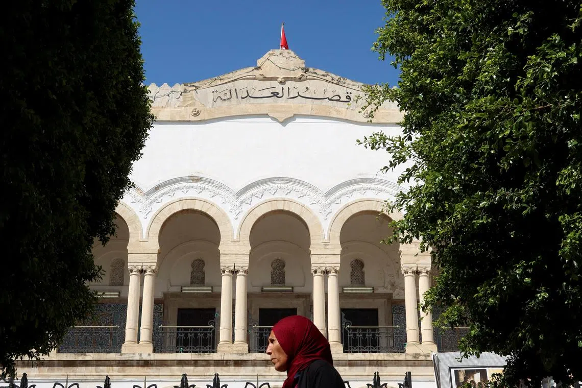 FILE PHOTO: A woman walks near the Palace of Justice in Tunis, Tunisia May 13, 2024. REUTERS/Jihed Abidellaoui/File Photo