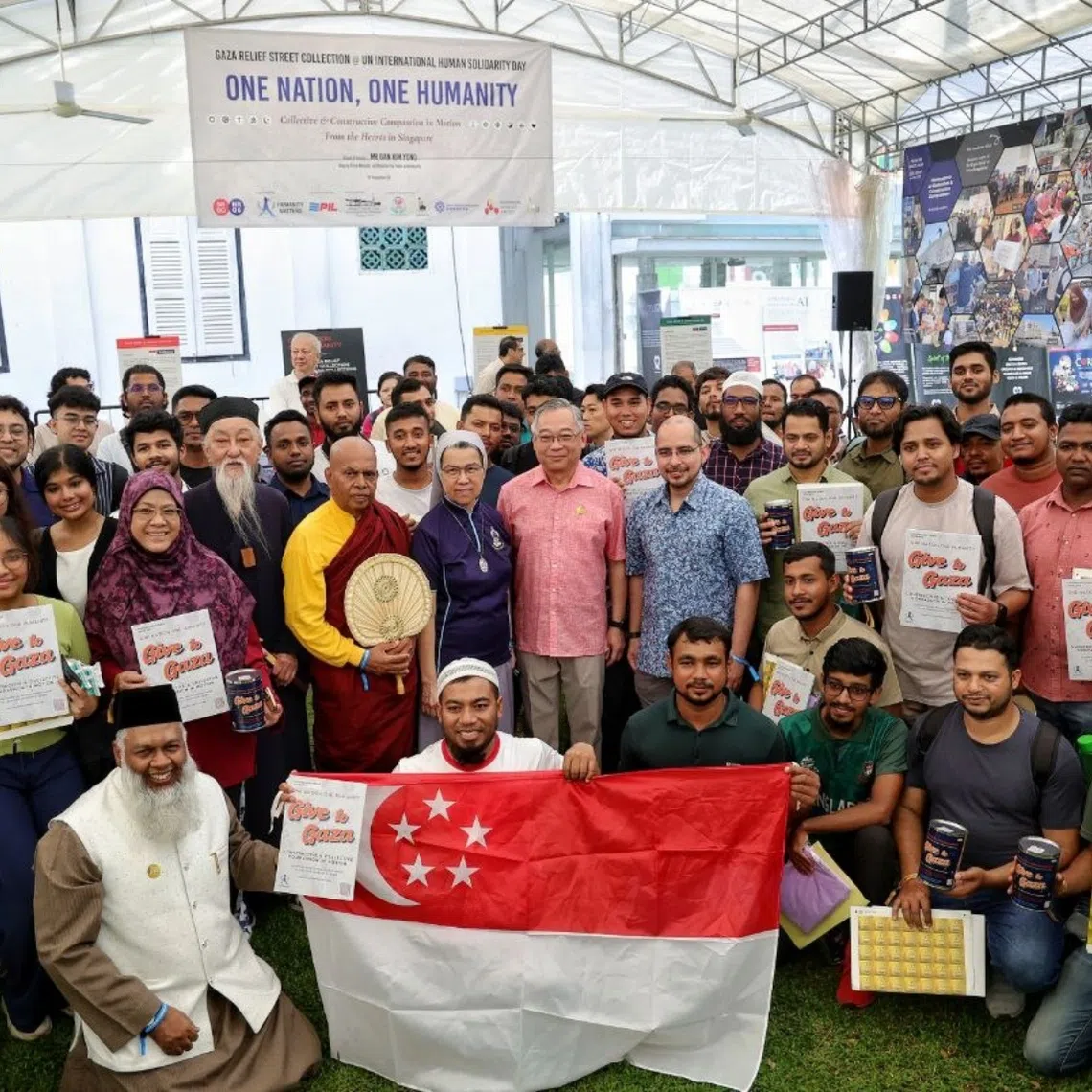 DPM Gan Kim Yong with volunteers and interfaith religious leaders during the fundraiser event on Dec 20.