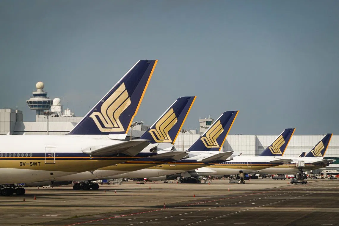 Singapore Airlines (SIA) aeroplanes at Changi Airport on Dec 24, 2022.