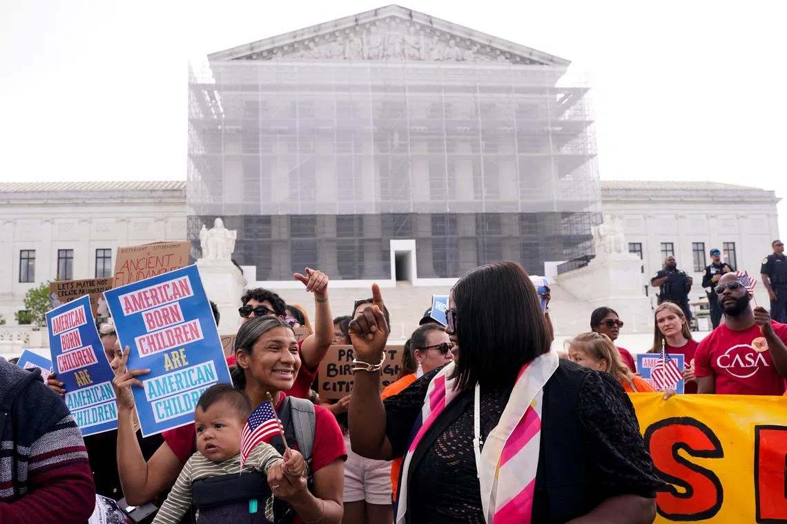 FILE PHOTO: Demonstrators rally on the day the Supreme Court justices hear oral arguments over U.S. President Donald Trump's bid to broadly enforce his executive order to restrict automatic birthright citizenship, during a protest outside the U.S. Supreme Court in Washington, D.C., U.S., May 15, 2025. REUTERS/Nathan Howard/File Photo