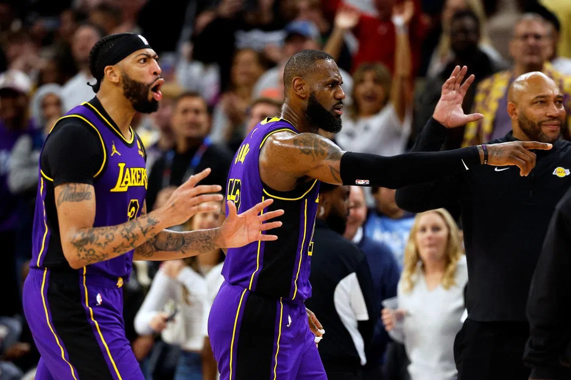 LeBron James (centre) and Anthony Davis of the Los Angeles Lakers reacting after it's announced James' basket is upheld as a two-point basket after review against the Minnesota Timberwolves in the fourth quarter at the Target Centre on Dec 30. The Timberwolves went on to beat the Lakers 108-106.
