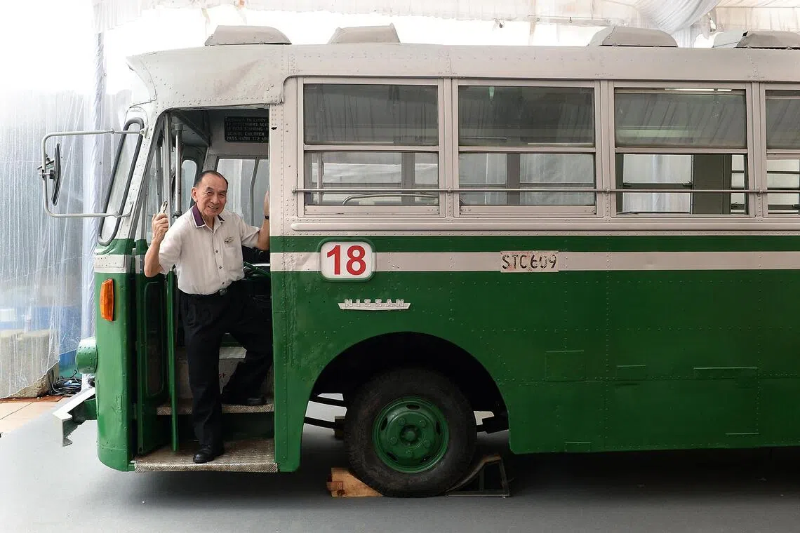 Former bus conductor Foo Ah Boon holding a ticket punch, a tool he first used in 1968.