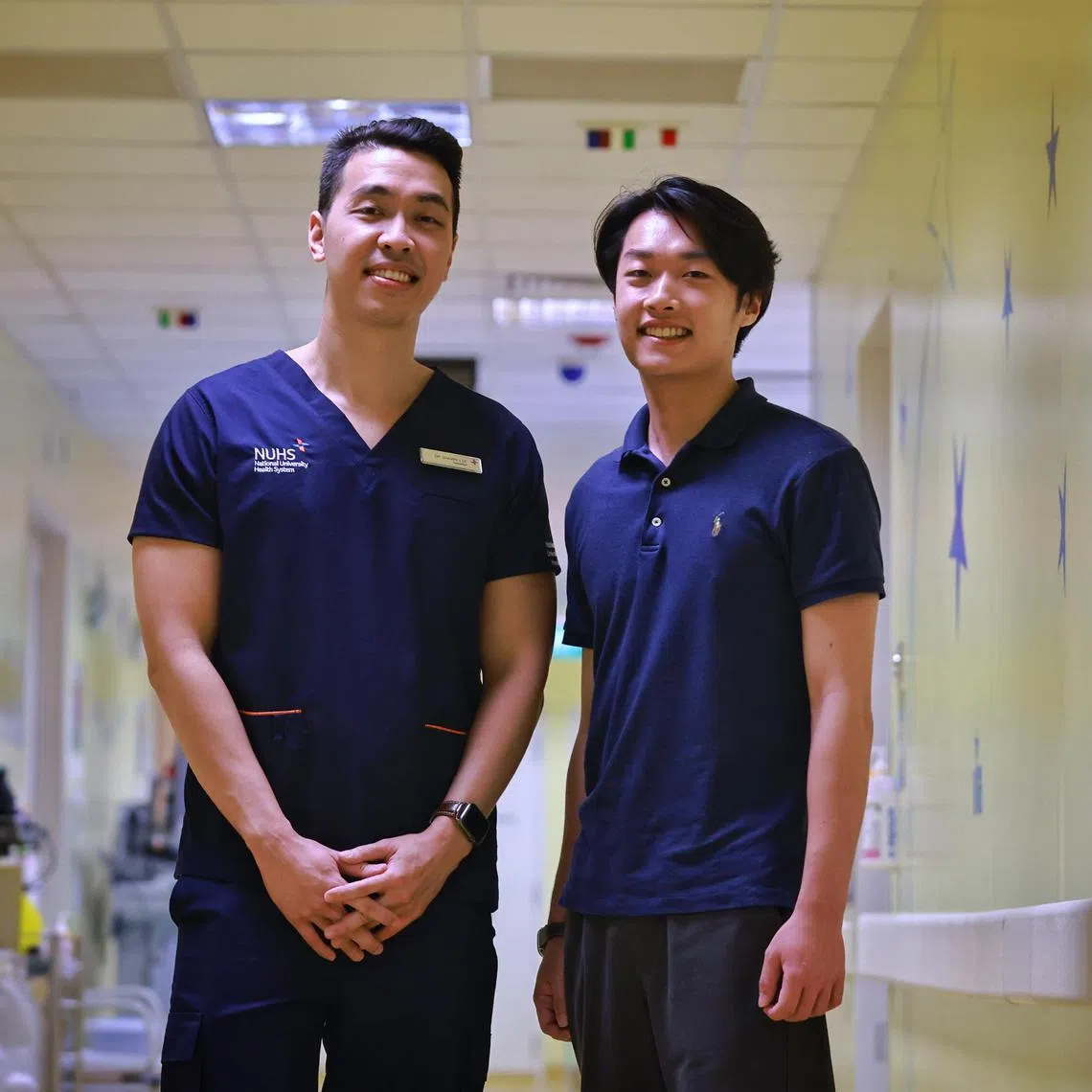 ST20230330_202370847512/jtblood03/Josiah Teo/Jason Quah

NUH’s Dr Shawn Lee (L) with patient Ryan Cho on March 30, 2023.