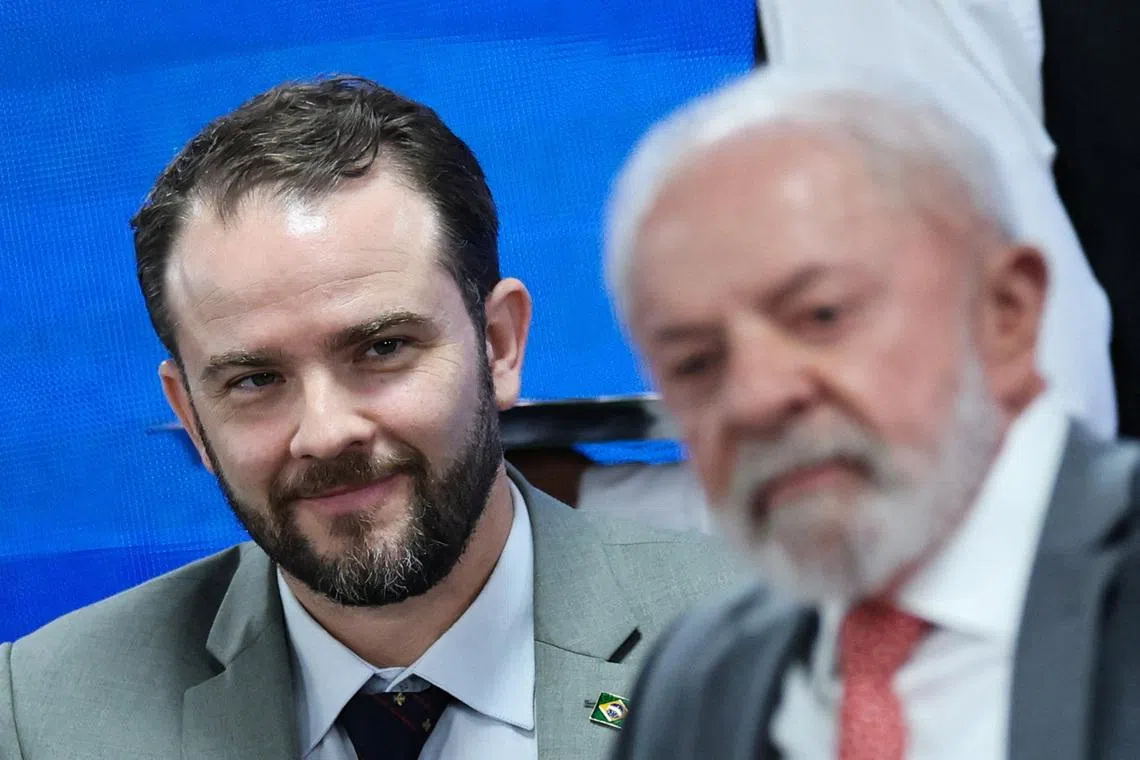 Brazil's Executive Secretary of the Ministry of Finance Dario Durigan looks on behind Brazil's President Luiz Inacio Lula da Silva during a ceremony to launch a digital platform for tax reform in Brasilia, Brazil January 13, 2026. REUTERS/Adriano Machado