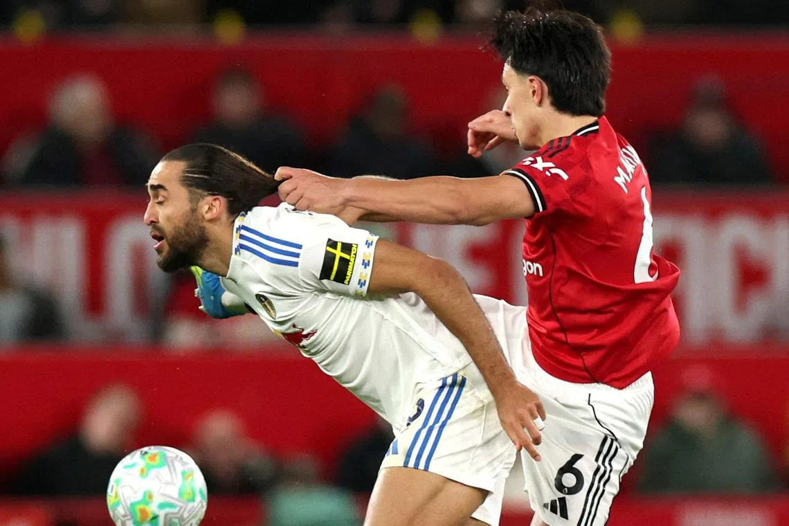 Soccer Football - Premier League - Manchester United v Leeds United - Old Trafford, Manchester, Britain - April 13, 2026 Manchester United's Lisandro Martinez fouls Leeds United's Dominic Calvert Lewin and is later shown a red card after a VAR review REUTERS/Phil Noble/File Photo