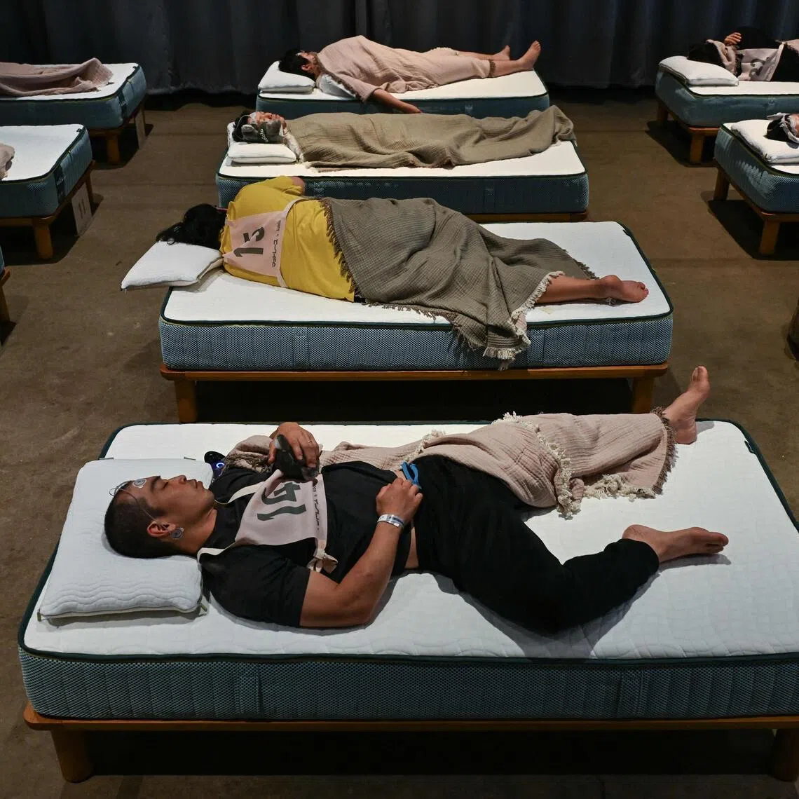 The Tokyo competition saw dozens of participants fitted with sleep tracking devices sprawl on comfy mattresses to slumber for up to 90 minutes.