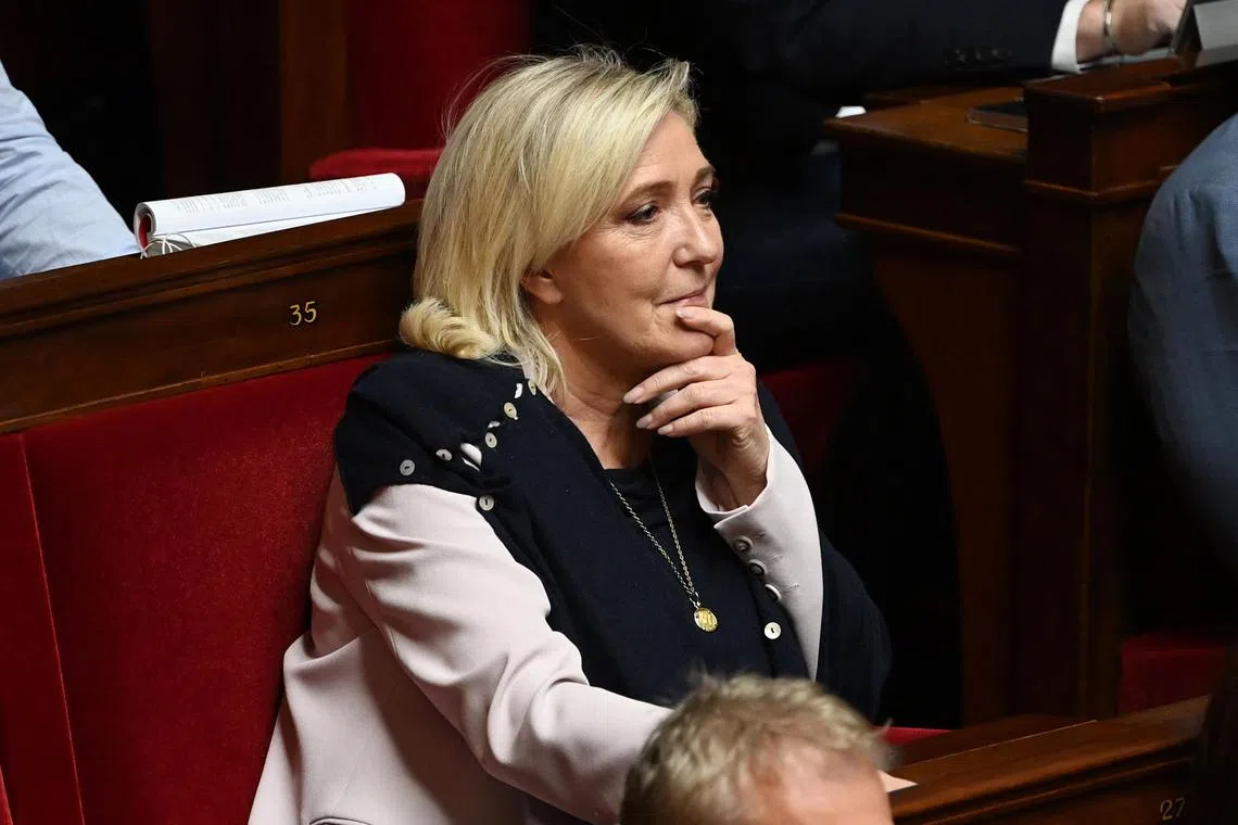 French far-right party Rassemblement National (RN) parliamentary group leader Marine Le Pen reacts during a session at The National Assembly in Paris on November 4, 2022.