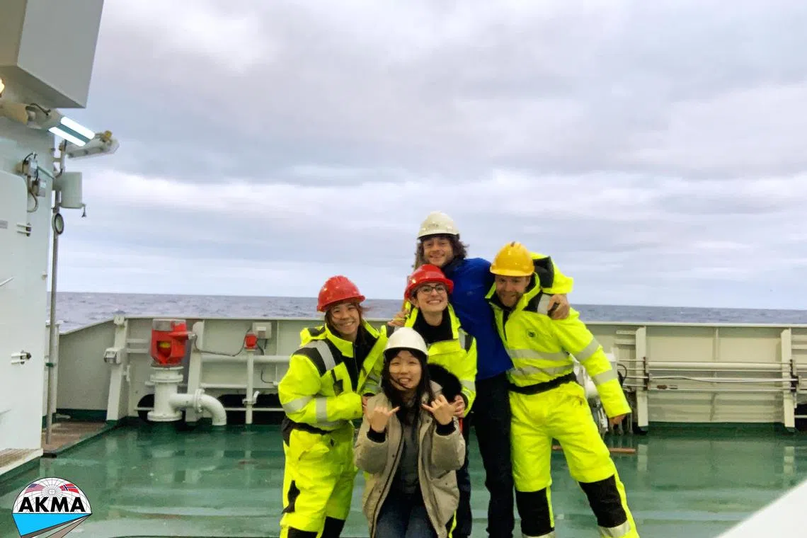 Dr Yan Yu Ting (left) and Ms Toh Yun Fann (foreground) on the deck of the vessel with their research mates.