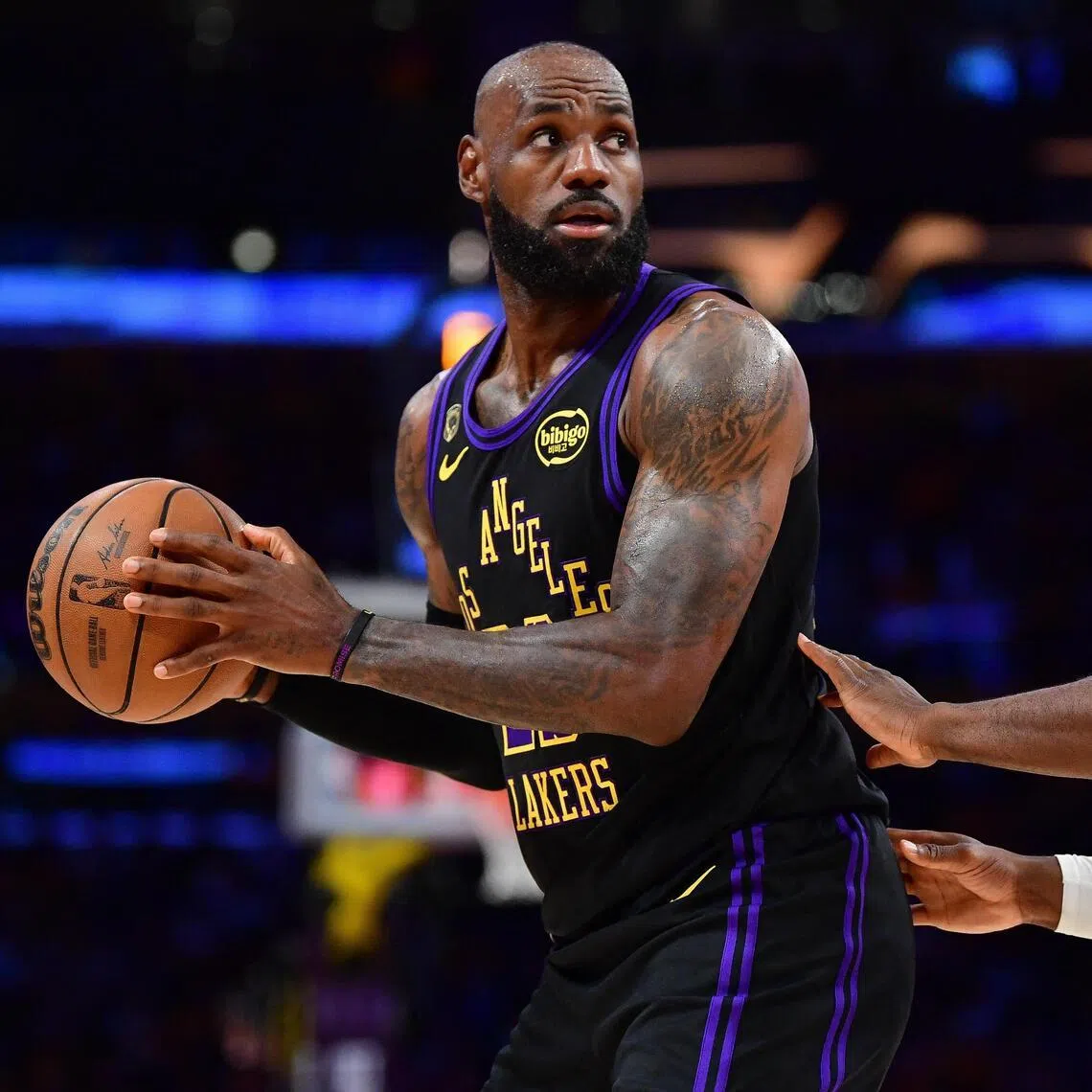 May 11, 2026; Los Angeles, California, USA; Los Angeles Lakers forward LeBron James (23) controls the ball against Oklahoma City Thunder guard Luguentz Dort (5) during the first half in game four of the second round of the 2026 NBA Playoffs at Crypto.com Arena. Mandatory Credit: Gary A. Vasquez-Imagn Images