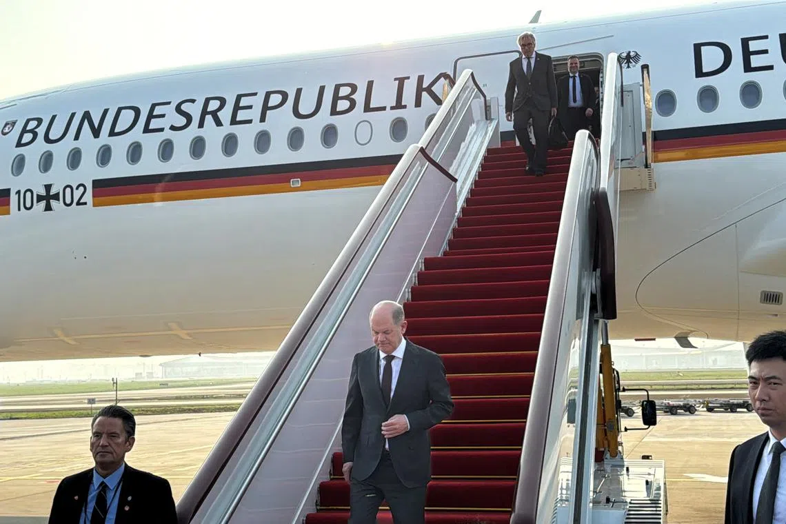 German Chancellor Olaf Scholz arrives at the airport in Chongqing, China April 14, 2024. REUTERS/Andreas Rinke