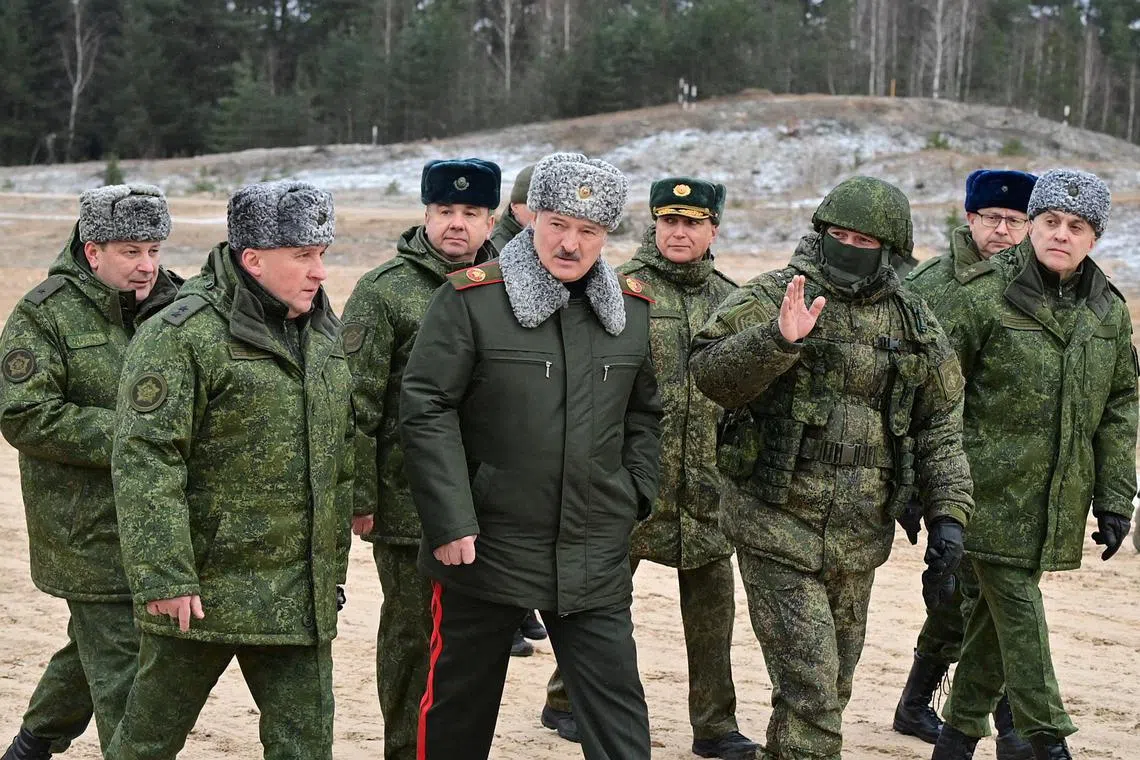 Belarusian President Alexander Lukashenko (centre) visiting the Obuz-Lesnovsky training ground, where Russian troops are stationed, in the Brest region, Belarus on Jan 6, 2023. 