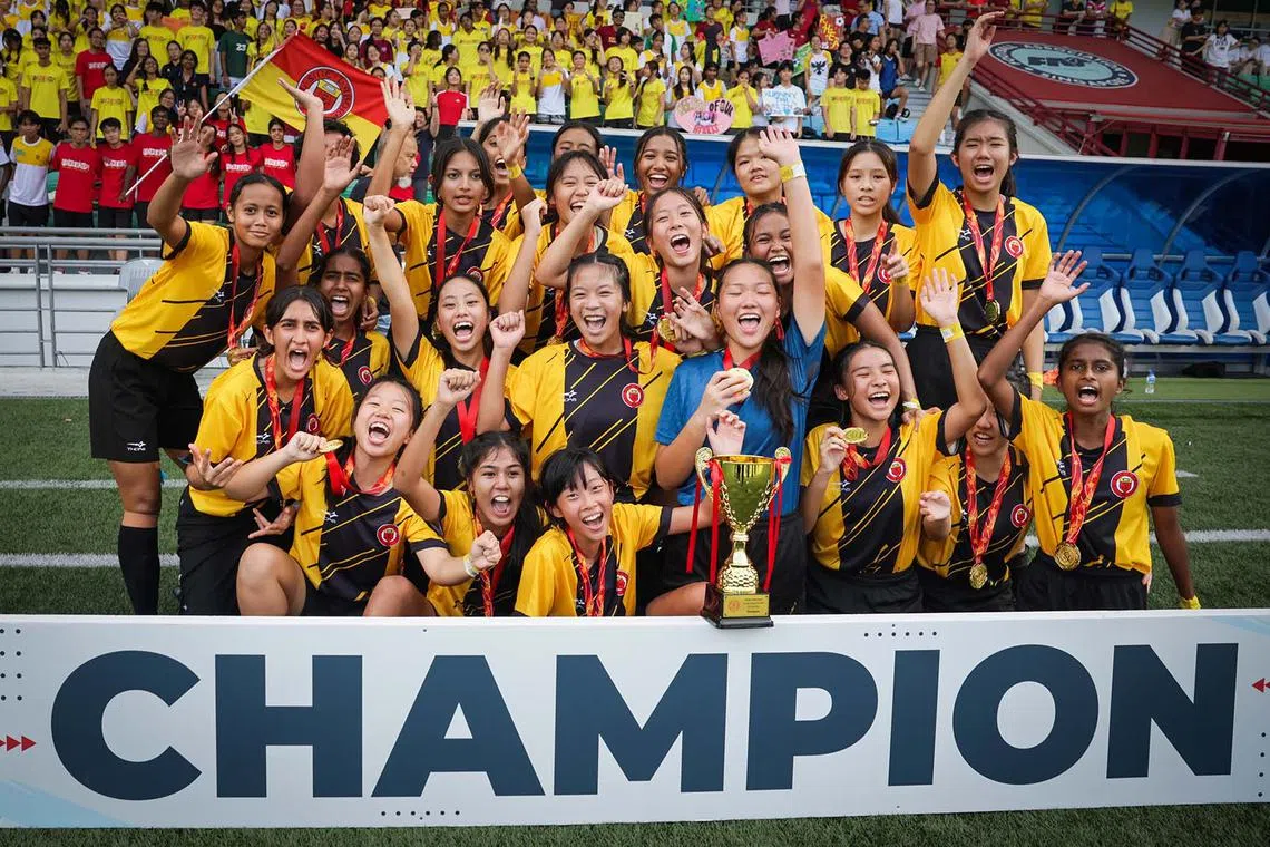 Victoria Junior College players celebrating after winning the A Division girls' football final against Hwa Chong Institution, at Jalan Besar Stadium, Singapore, on May 21, 2025.