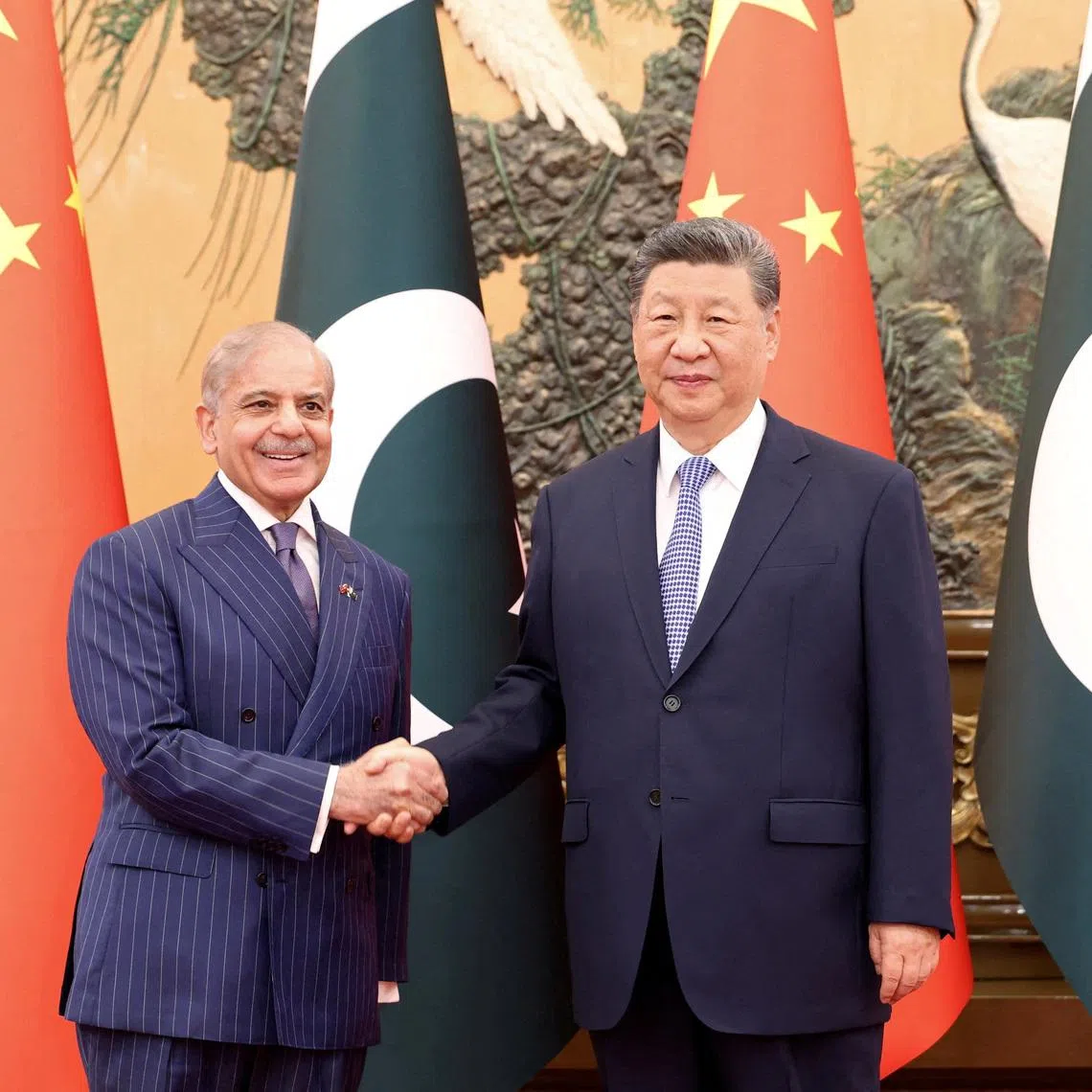 Chinese President Xi Jinping and Pakistani Prime Minister Shehbaz Sharif shake hands at the Great Hall of the People in Beijing, China May 25, 2026.  China Daily via REUTERS