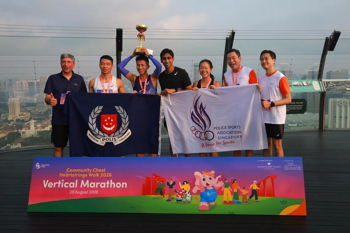The winning team, Climb Warriors from the Singapore Police Force, pose for a photo with SPS Eric Chua (second from right), Community Chest Heartstrings Walk 2026 Committee Co-Chairperson and City Developments Limited Group Chief Operating Officer Kwek Eik Sheng (right), and Community Chest Heartstrings Walk 2026 Committee Co-Chairperson and Marina Bay Sands Communications & Corporate Affairs Senior Vice President Nicholas Ionides (left).