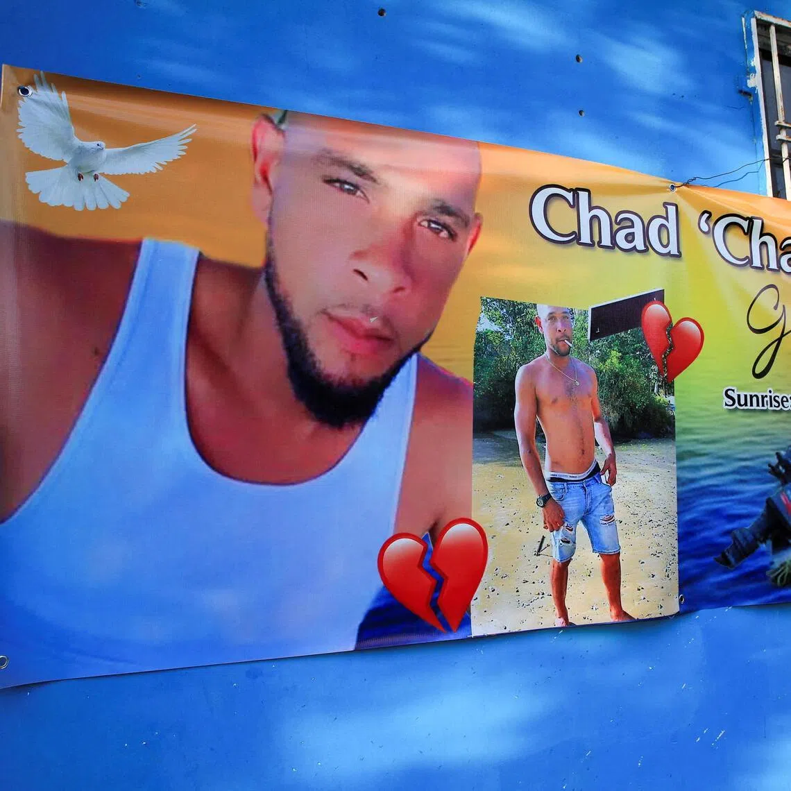 A banner hanging outside the family home of Chad Joseph, - a victim of US missile strikes on vessels off Venezuela.