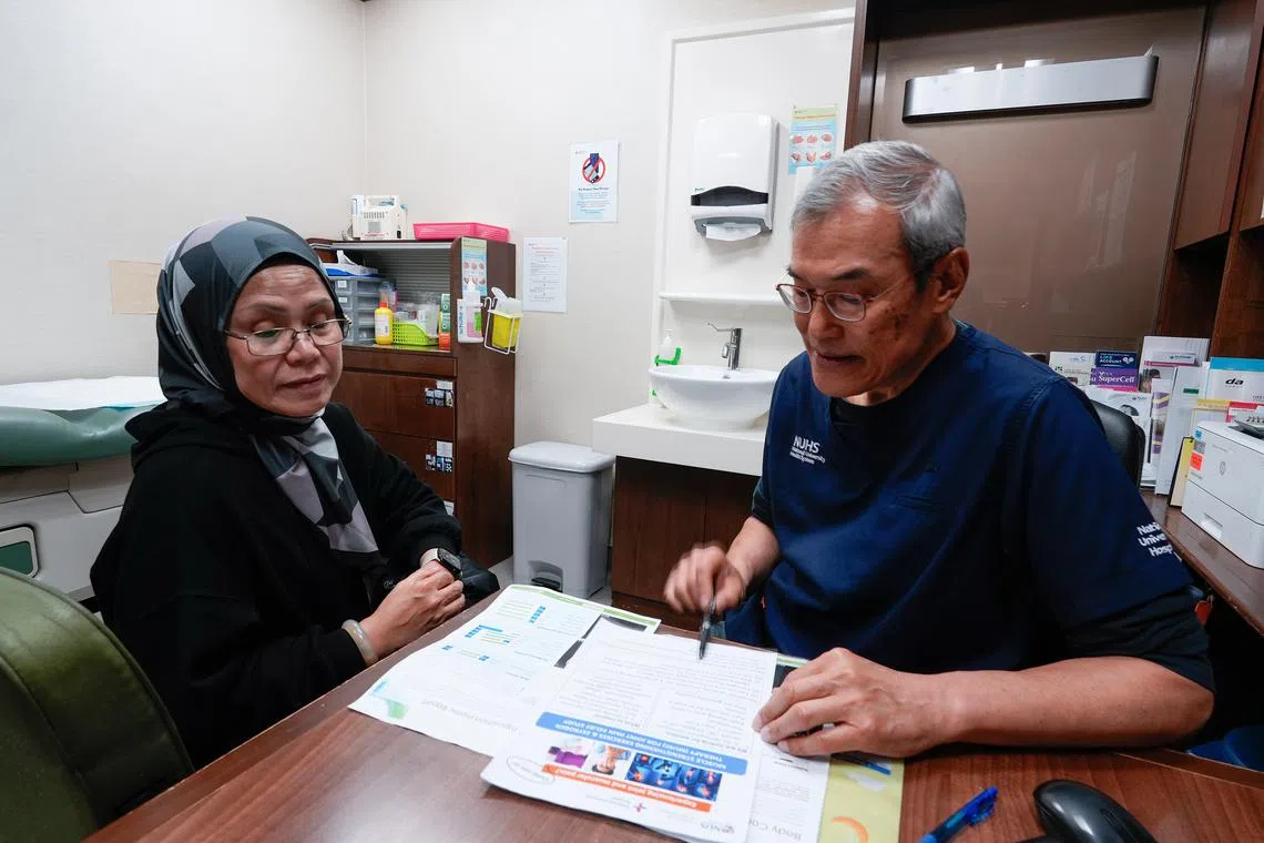 Madam Sabarina Jumarudin, a participant of the Integrated Women’s Health Programme (IWHP) at NUH and the NUS Yong Loo Lin School of Medicine, with IWHP lead Yong Eu Leong.