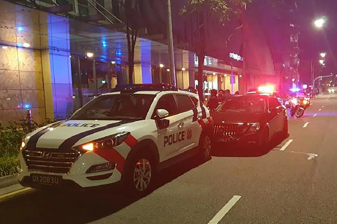 Meng Xianglei drove himself straight into a stationary police car along Somerset Road.