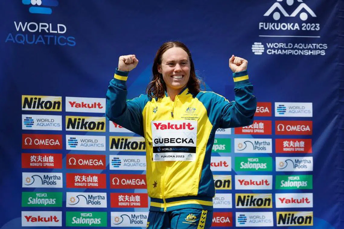 FILE PHOTO: Fukuoka 2023 World Aquatics Championships - Open Water Swimming - Seaside Momochi Beach Park, Fukuoka, Japan - July 15, 2023  Silver medallist Australia's Chelsea Gubecka celebrates on the podium during the medal ceremony for the women's 10km final   REUTERS/Issei Kato/File Photo