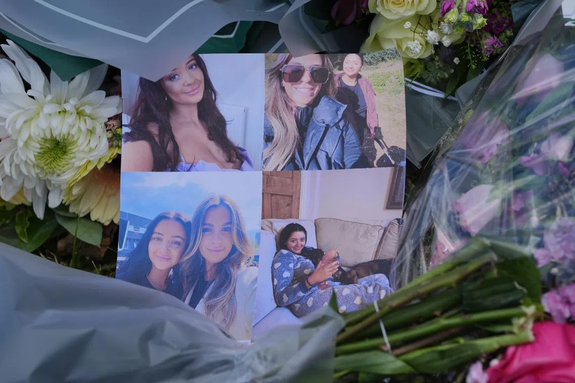 A floral tribute left at the home of BBC sports commentator John Hunt, where his wife Carol and two of their daughters, Hannah, 28, and Louise, 25, were killed in July 2024.