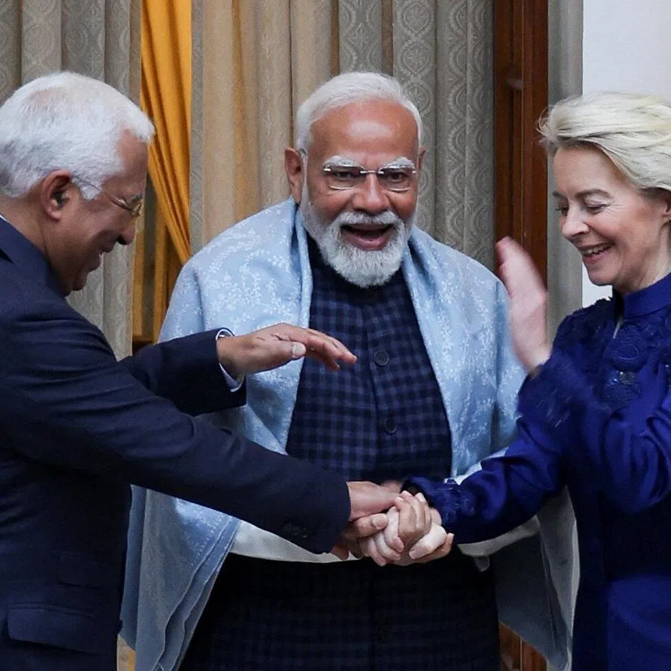 European Council President Antonio Costa, European Commission President Ursula von der Leyen and Indian Prime Minister Narendra Modi hold hands ahead of their meeting at the Hyderabad House in New Delhi, India, on Jan 27, 2026. 