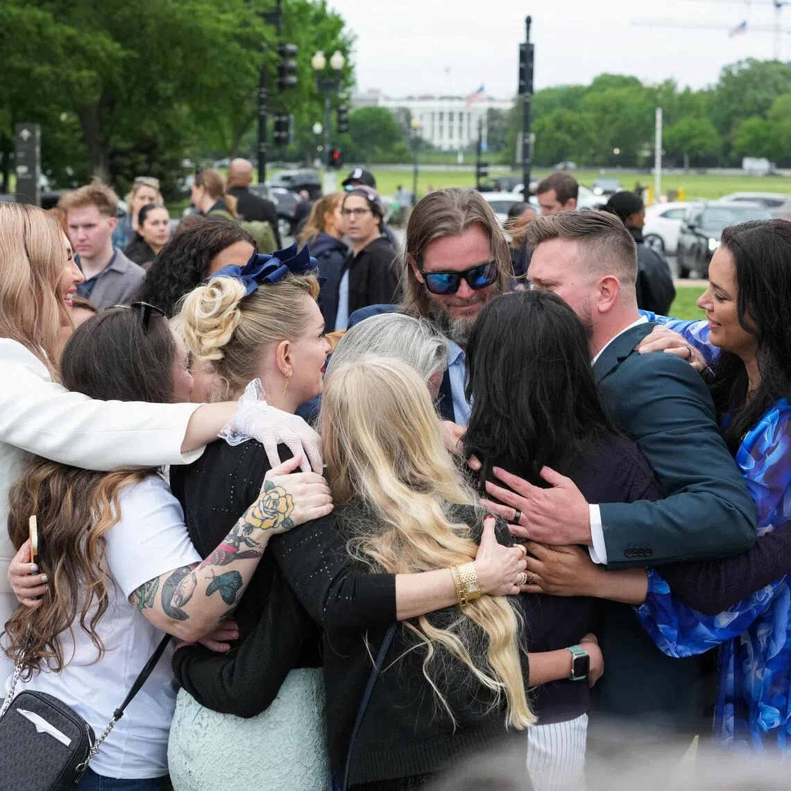 Virginia Giuffre's family during a "butterfly" vigil commemorating the one-year anniversary of her death. She was a victim of late financier and sex offender Jeffrey Epstein.