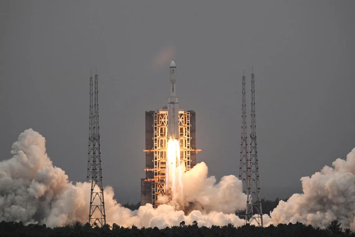 A Long March-8 rocket, carrying the relay satellite Queqiao-2 for Earth-Moon communications, blasts off at the Wenchang Space Launch Centre in Hainan province on March 20, 2024.